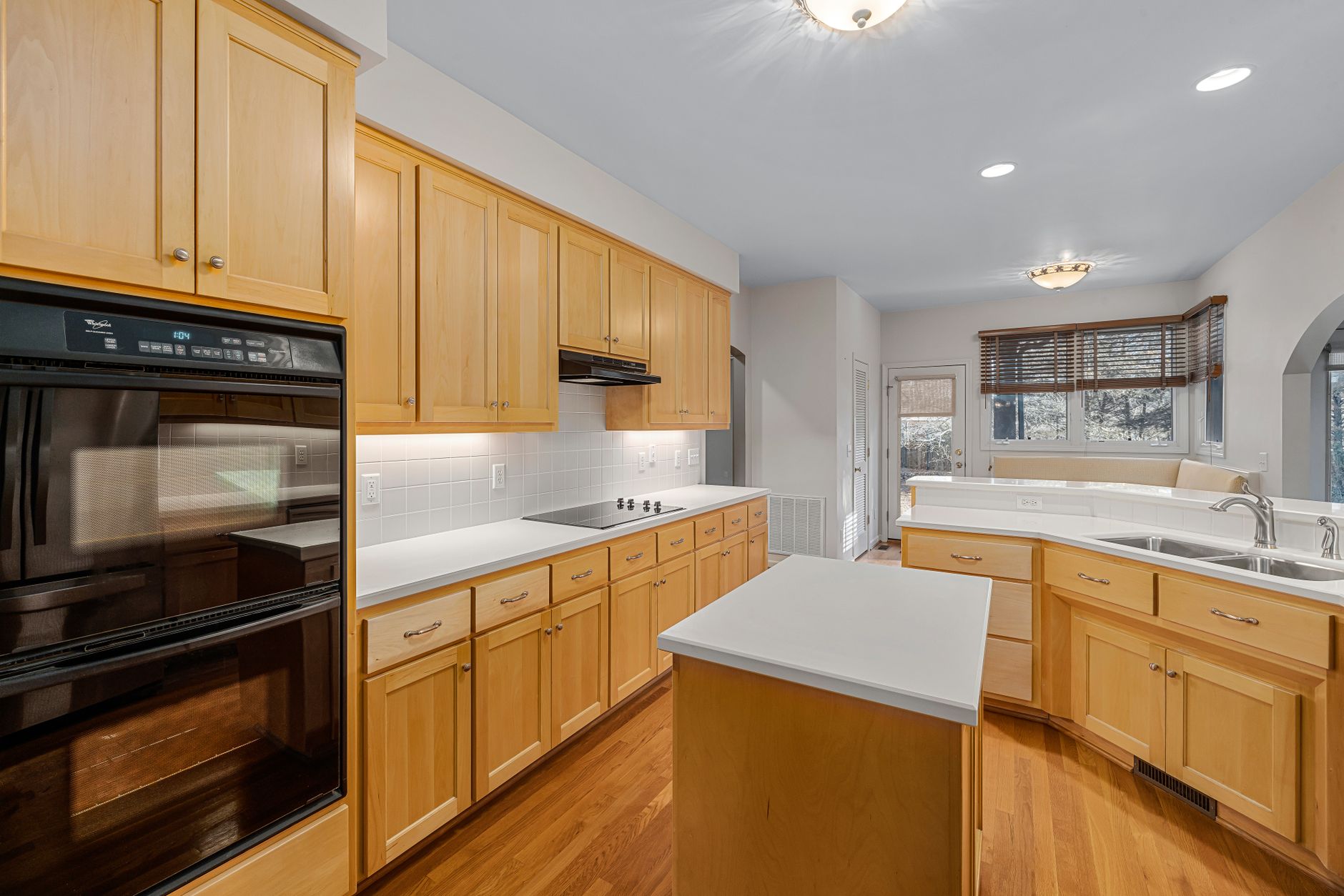Kitchen — Terracotta and white oak, kept simple for a house used in bursts.