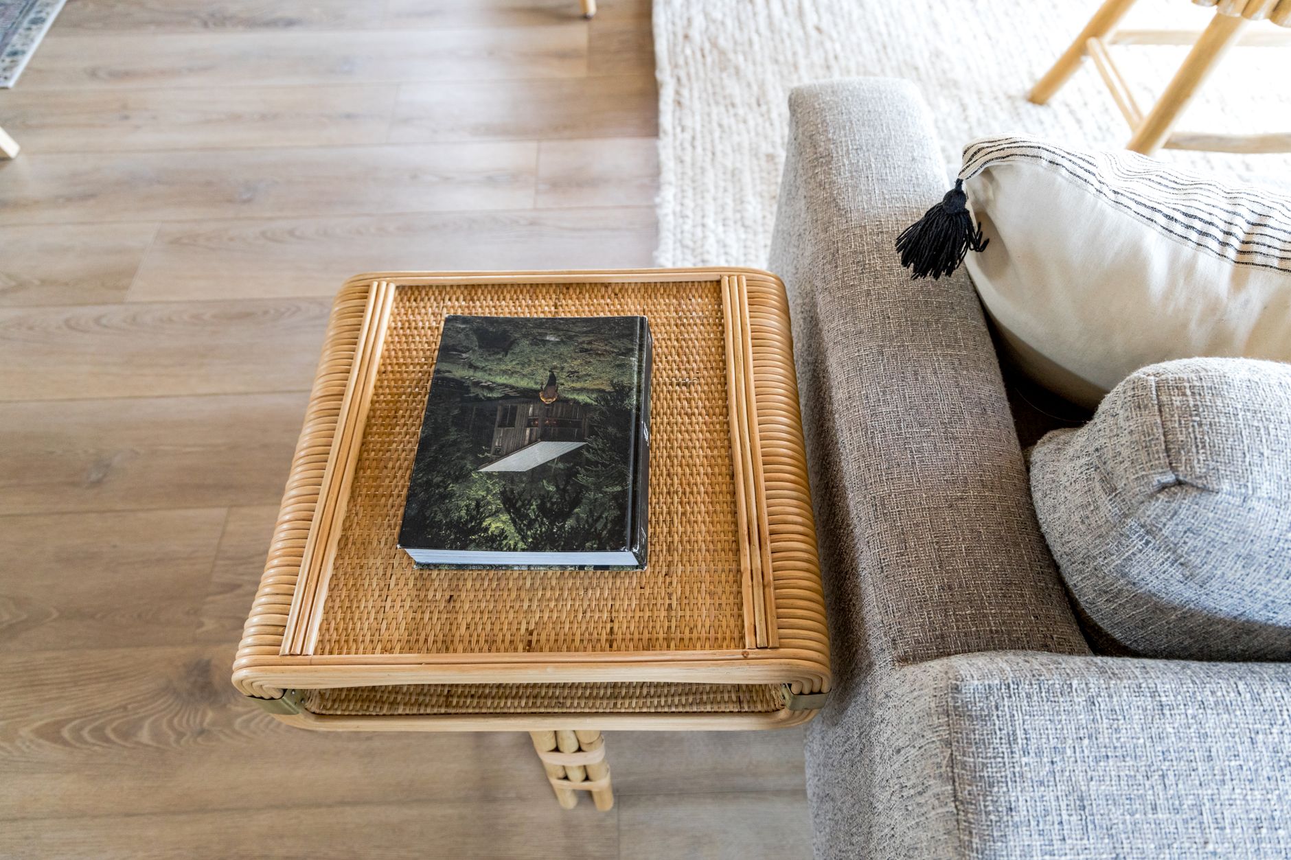 A bleached, salt-and-sun palette — plaster, rattan, washed oak.