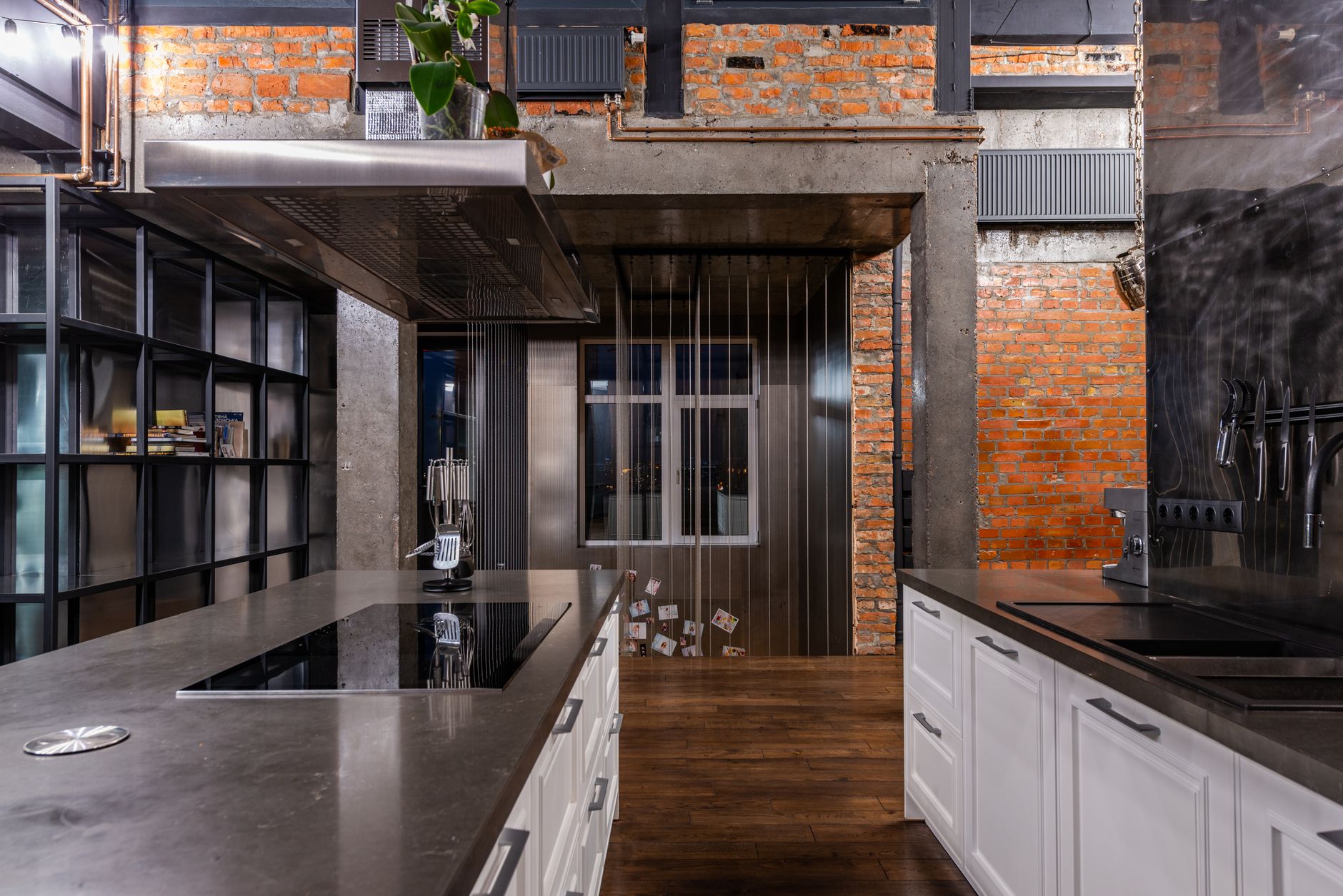 Kitchen — Blackened steel, oak, and a concrete run that nods to the bones.